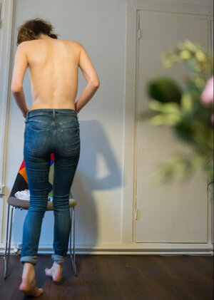 Slim brunette hides her natural bush with good-looking panties and pulls jeans on