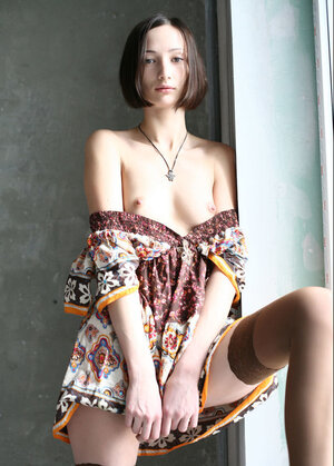 Kitten poses in dress and then takes it off opening her shaved vag on windowsill