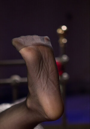 Skinny dominating MILF in stockings impresses male sub with pleasant footjob