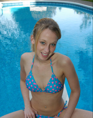 Erotic poolside photo-shoot of the underweight blonde posing in sexy swim-suit