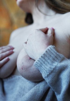 Luscious brunette starlet in stockings reveals huge natural boobs and plus cunny