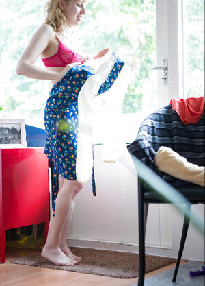 Hot blonde headed girl with a naked body showing her firm booty