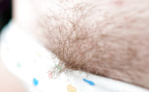 Brunette with jet black hair is going to show her cleavage