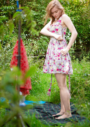 Slim babe decides to strip outside to show off her body