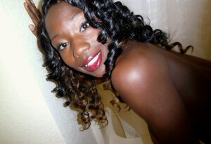 Aroused ebony takes pics of her huge round bra buddies to attract penises
