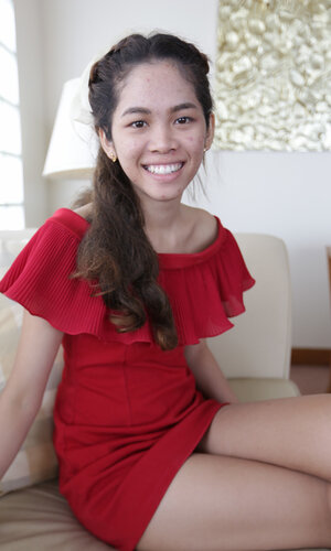 Cute Thai teen has fun walking with a foreign photographer