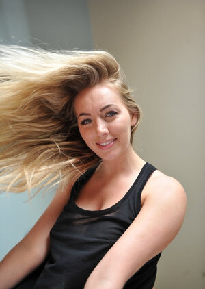 Hayley Coppin shows off her ideal melons & poses naked by the window