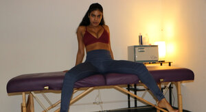 Charming brunette masseuse offers an arousing handjob while topless