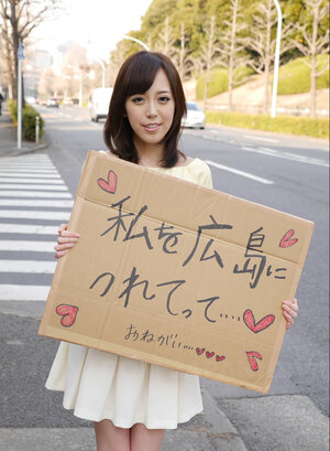 Shiori Yamate reveals her hot boobs and also sucks a purple rod in a car