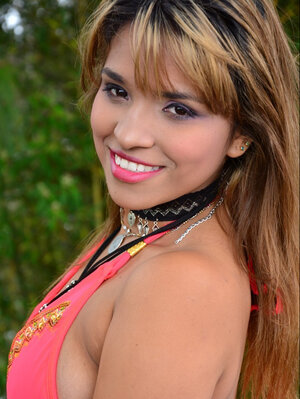 Kathy Solis flaunts her moist bum in a mini bikini outdoors