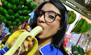 Tattooed Marly Romero licks banana lustful in public