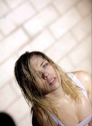 Lia Lor shows her soaked small tits after training hard