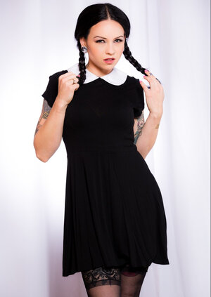 Necro Nikki strips and besides spreads as Wednesday Addams