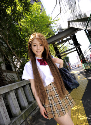 Japanese schoolgirl Ria Sakurai flashes sexy panties outside