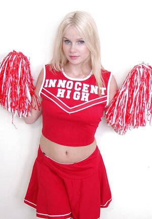 Cheerleader in the red Innocent High uniform gives upskirt contemplate and bares tits