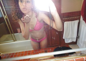 Curly Latina student broad takes some intimate pics in the bathroom