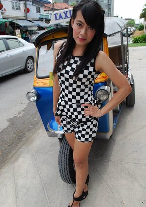 Inviting Thai porn model in a checkered dress gets into the Tuk Tuk Taxi