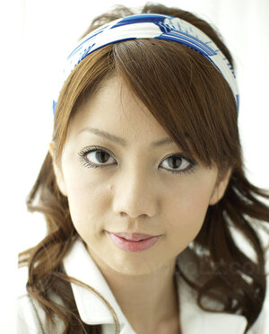 Modest Japanese hottie dressed in white dress that accentuates her slimness