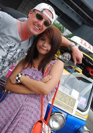 Asiatic 18-19 year old Tukta with red hair wears sexy violet dress and prefers Tuk Tuk taxi