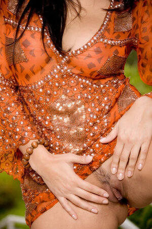 Broad pulls orange dress up showing off the bra buddies and additionally plays with vag