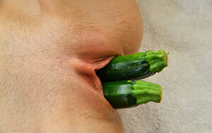 Steamy cutie pie puts several zucchini in slit simultaneously stretching it
