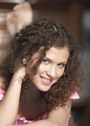 Curly-haired sweetie Juliette Shyn relaxes totally naked near swimming pool