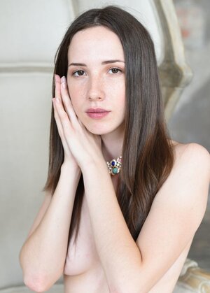 Hoe is a hot stripper who poses by big clock face & sitting on tree or swing