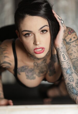 Inked sweetie is alone at home and moreover can freely show on camera her assets
