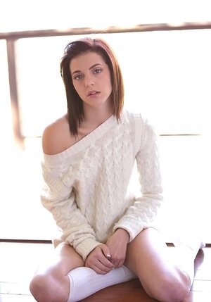 Thoughtful 18-19 y.o. Kiera Winters takes off white sweaters & panties on the balcony