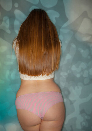 Rotund girl seductively shows natural tits and furthermore sexy bush in her room