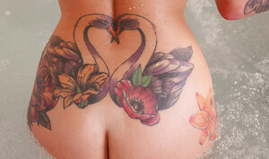 Tattooed Daniella Mae with nice-looking titties gets in a bathtub to wash her body