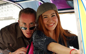 Clothed Thai broad with a smoking hot face and red hair can brag about wonderful legs