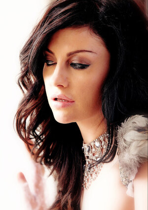 Adorable black-haired angel on heels strips naked to expose her glamorous body