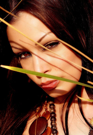 Mind-blowing black-haired cougar is happy to show large naturals in high grass