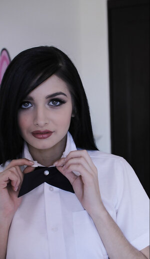 Offensive whore with long black hair flashes her little tits without stripping