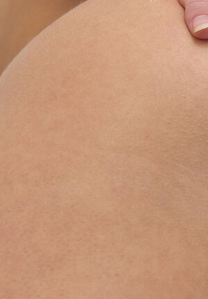 Big-breasted girl poses completely nude and plus plays with her tight snatch on the chair