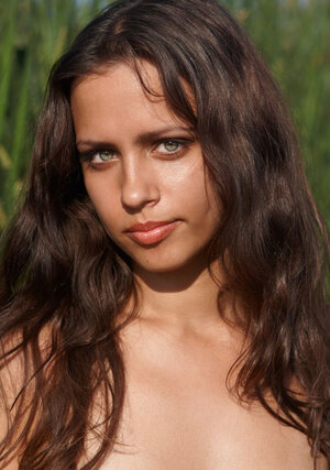 Youthful beauty with perky boobs loves nature and plus poses nude in the river