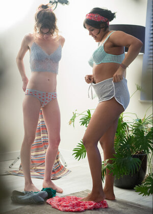 Arab kitten in a headband and nerdy roommate time and again put on clothes together