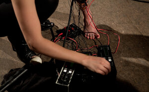 Undressed inked slave-girl hangs from the ceiling and gets electrically tortured