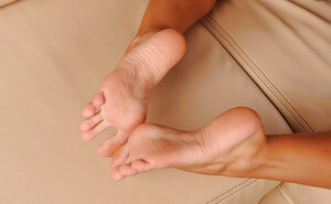 Smoking hot tall cutie sucks own lovely feet while exposing her assets