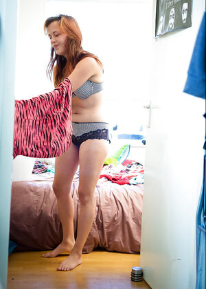 Sexy babe Lynn with red hair wakes up and gets dressed before the new day